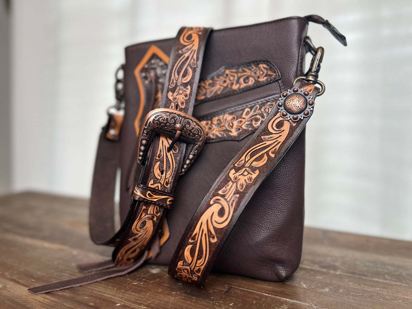 Concho Leather Crossbody with tooling and fringe accents