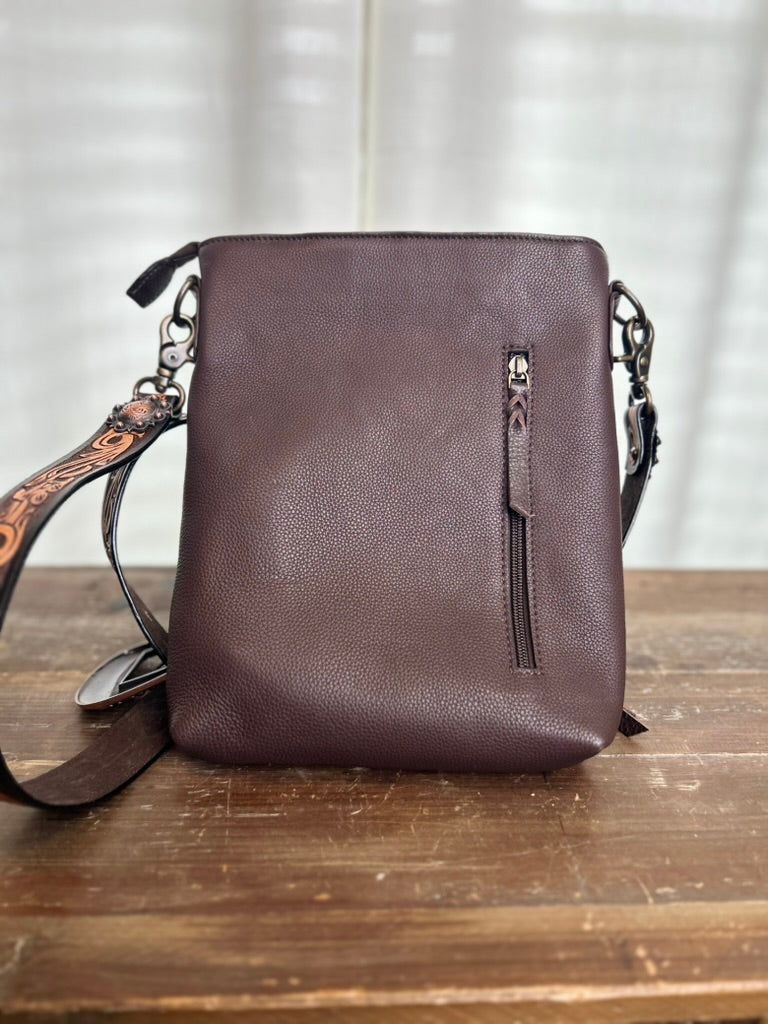 leather purse with tooled strap